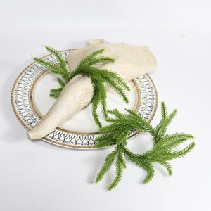 Norfolk pine Christmas napkin rings with green wreath design for festive table settings