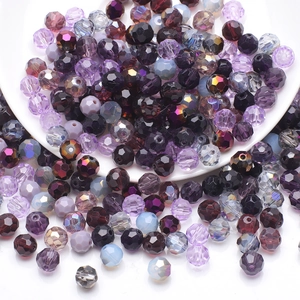 Close-up of faceted crystal glass beads in purple and black for DIY jewelry making