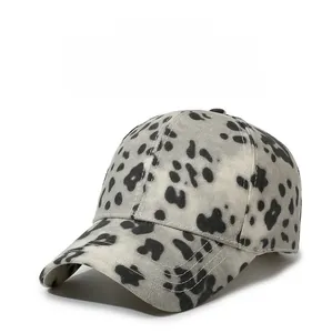 Detail of leopard print baseball cap featuring breathable cotton fabric and curved brim