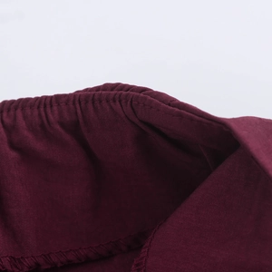 Burgundy straight leg trousers for women with elegant pleated waist and button details