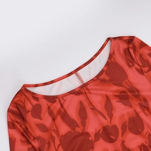 Detail of round neckline with double stitching on red tulip printed elegant dress