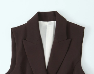 Detail shot of a dark brown sleeveless waistcoat collar with smooth inner lining