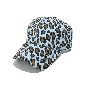 Detail of light blue leopard print baseball cap with reinforced stitching and curved brim