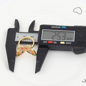 Detailed measurement showing the 25.3mm width of gold butterfly ring with colorful stones