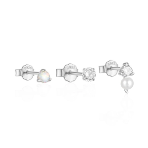 Detail shot of 925 silver stud earrings set featuring opal, zircon, and pearl accents