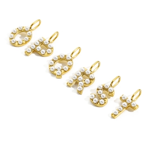 Detail of O P Q R S T golden letter charms with white pearls for DIY jewelry making
