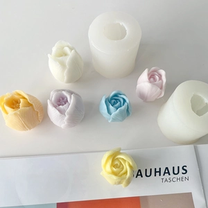 Macro detail of tulip and rose silicone molds showing colorful DIY candles in macaron shades