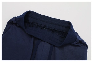 Detailed view of elastic waistband and adjustable drawstring on navy sport trousers