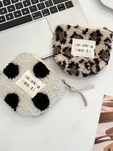 Plush heart-shaped mini coin purses in polka dot and leopard print with metal zippers