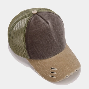 Close-up of distressed baseball cap with mesh back and vintage washed canvas details