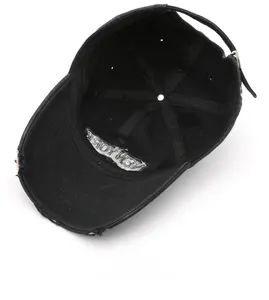 Macro detail of black washed cotton baseball cap interior with NEW YORK embroidery