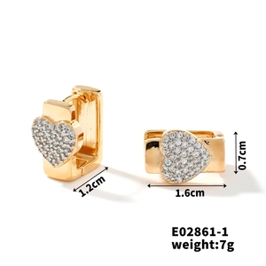 Detailed view of gold heart earrings with micro-set zircon and size dimensions