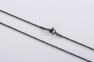 Close-up of a gun-metal black stainless steel snake chain featuring a lobster clasp closure