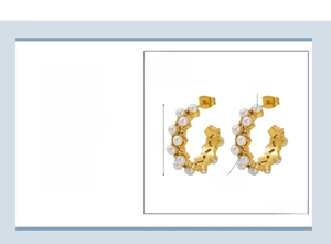 Detail view of 18k gold plated C-shaped earrings with pearls and rhinestones