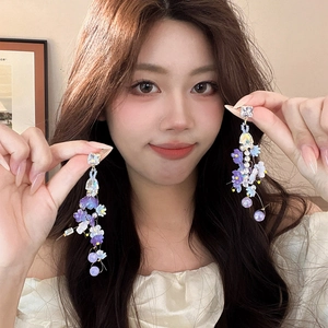 Floral tassel earrings with purple resin petals and sparkling crystals for women