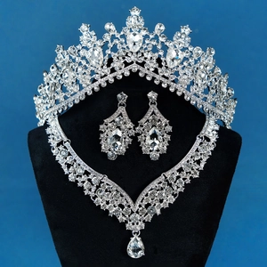 Luxurious silver bridal set with sparkling water-drop rhinestones on elegant black mannequin