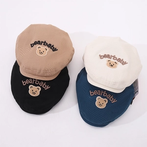 Detail view of cotton baby berets in four colors with cute bear baby embroidery