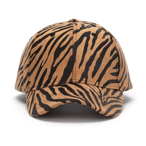 Classic baseball cap with brown and black zebra animal print in soft suede-like fabric