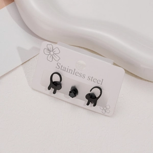 Set of three stainless steel black cat earrings and a round stud on a white background