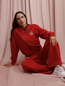 Tuta rossa da donna a due pezzi con felpa con zip e pantaloni larghi a vita alta