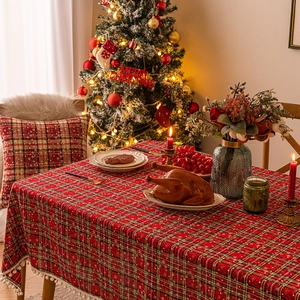 Christmas snowflake plaid tablecloth with white pompom tassels for festive dining decor