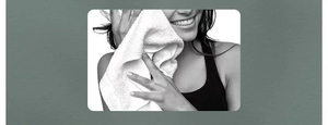 Close-up of soft 3D textured bath sponge being used on facial skin for gentle cleansing
