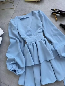 Elegant light blue V-neck long sleeve dress with waist tie and layered ruffle skirt