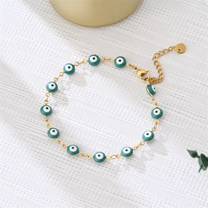 Golden chain bracelet with blue and green evil eye enamel beads and adjustable clasp