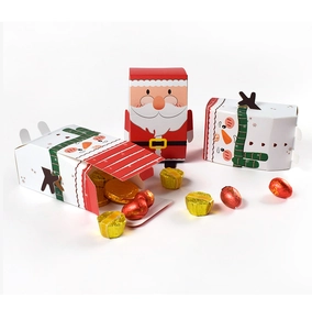 Detailed view of colorful Christmas candy boxes with Santa and snowman cartoon designs