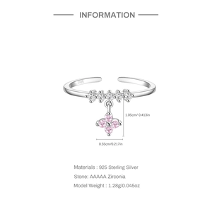 Detail of S925 silver open ring with pink zircon clover pendant and clear stones