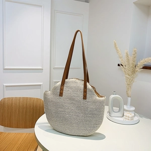 Retro large capacity straw shoulder bag with brown leather straps for summer vacations