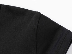 Close-up of shoulder seam and neckline on black quick-dry stretch athletic t-shirt