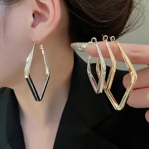 Polished geometric rhombus hoop earrings in silver and gold minimalist finish