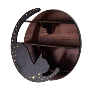 Detailed view of dark wood boho shelf featuring a carved cat and moon silhouette