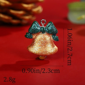 Detail view of gold Christmas bell charm with green bow and size 1.06 x 0.90 inch dimensions