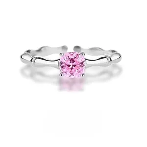 Macro detail of S925 silver ring with bamboo style texture and pink square gemstone