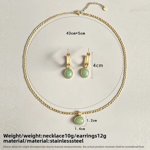Detail view of aventurine jewelry set featuring gold stainless steel chain and earrings