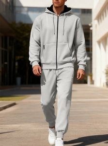 Detail of grey men's full-zip fleece tracksuit with drawstring hood and side pockets