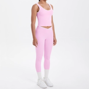 Detail of pink yoga set showing criss-cross high waist design and contrast white binding