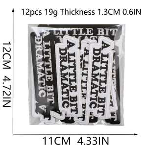 Set of 12 black and white A Little Bit Dramatic embroidered iron-on patches with dimensions