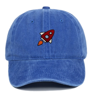 Close-up of red rocket embroidery on navy blue washed cotton baseball cap