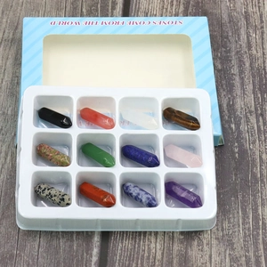 Detail view of 12 natural crystal hexagonal pillars in a blue display gift box packaging