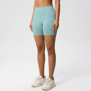 Close-up of seamless teal yoga shorts with high-waisted wide band and ribbed texture