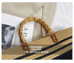 Detail of bamboo handle and woven texture on a large capacity striped tote bag