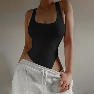 Close-up detail of black ribbed knit bodysuit with sleeveless halter neck design