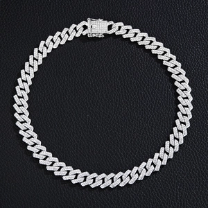 Detailed view of silver Cuban link chain with full crystal inlay on black leather