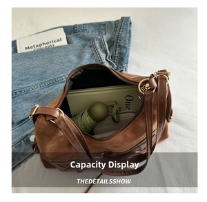 Detail view of large brown suede tote bag showing spacious interior with daily essentials