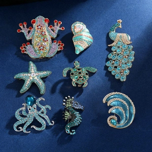Set of 8 sparkling rhinestone sea animal brooches featuring turtle peacock and octopus designs