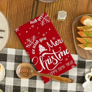 Microfiber Christmas kitchen towel with red snowflake design and Merry Christmas lettering