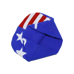 Close-up of winter knit beanie with USA flag stars and stripes pattern texture